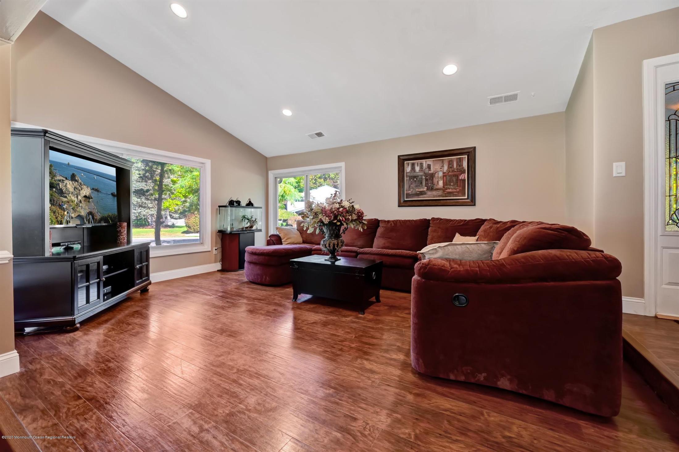 27 Sugar Bush Road Howell, NJ 07731 - Photo 8 of 46 a living room with furniture and a flat screen tv