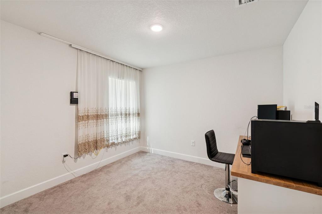 10358 Musa Road Spring Hill, FL 34608 - Photo 30 of 48 a view of workspace with wooden floor