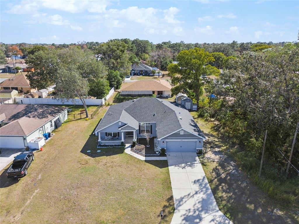 10358 Musa Road Spring Hill, FL 34608 - Photo 3 of 48 a aerial view of a house with a yard