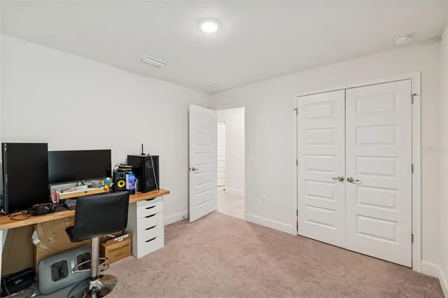 a view of a workspace with furniture