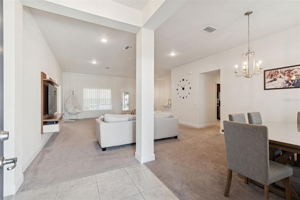 10358 Musa Road Spring Hill, FL 34608 - Photo 7 of 48 a living room with furniture and a flat screen tv