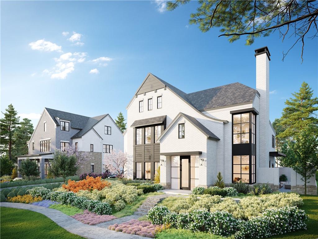 a front view of a house with a garden