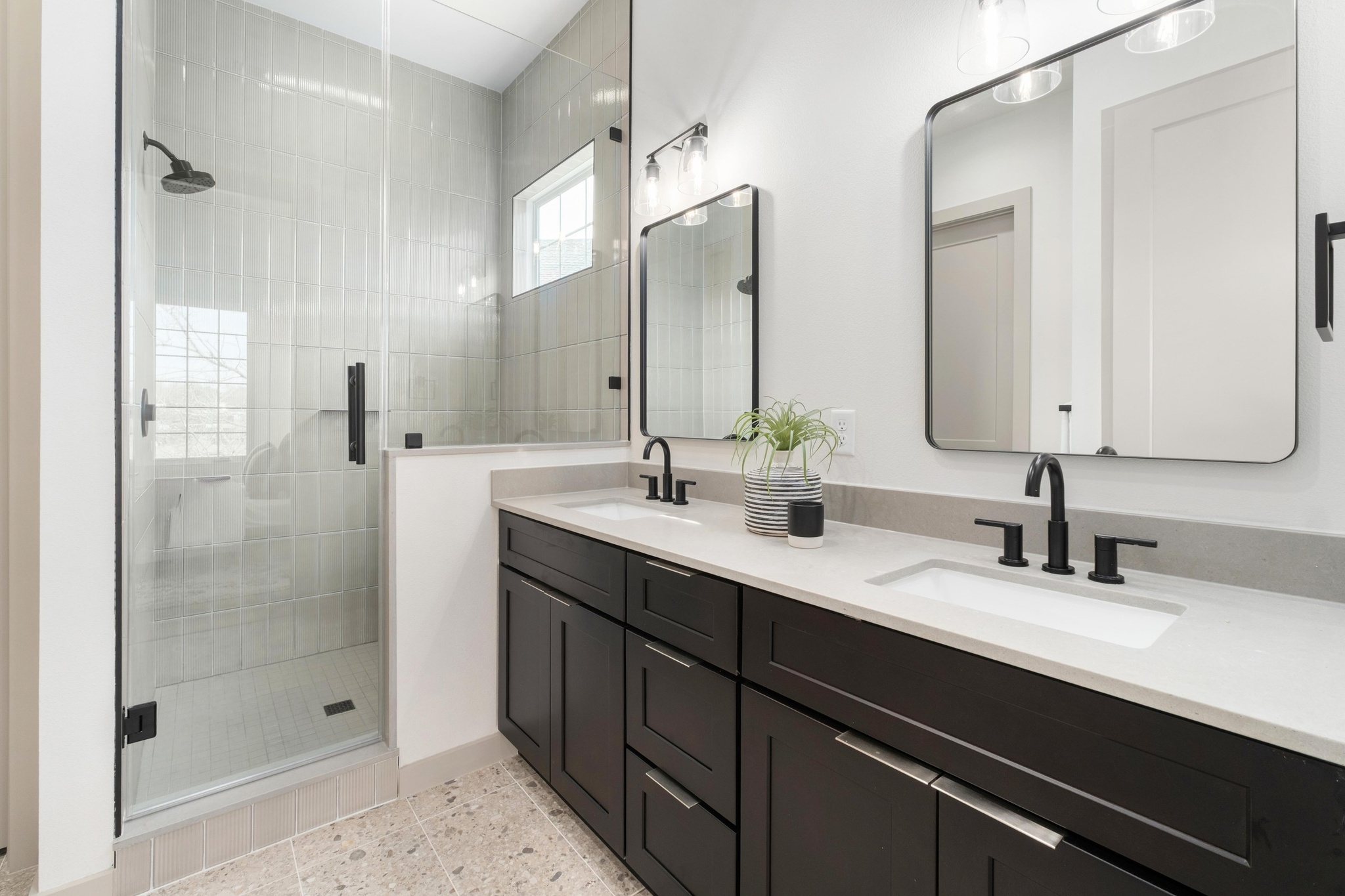 1736 Bunche Road, Unit B2 Austin, TX 78721 - Photo 4 of 37 he primary retreat feels intentionally serene, with a spacious walk-in closet and a spa-inspired bathroom featuring dual vanities and an impressive walk-in shower wrapped in floor-to-ceiling tile.