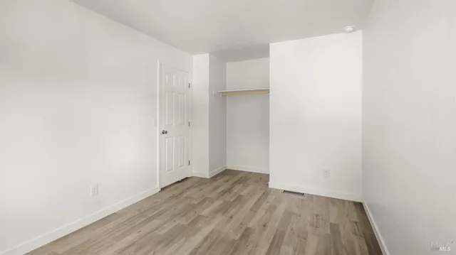 a view of small space with wooden floor