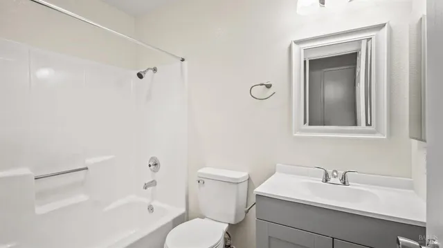 a bathroom with a sink toilet and vanity