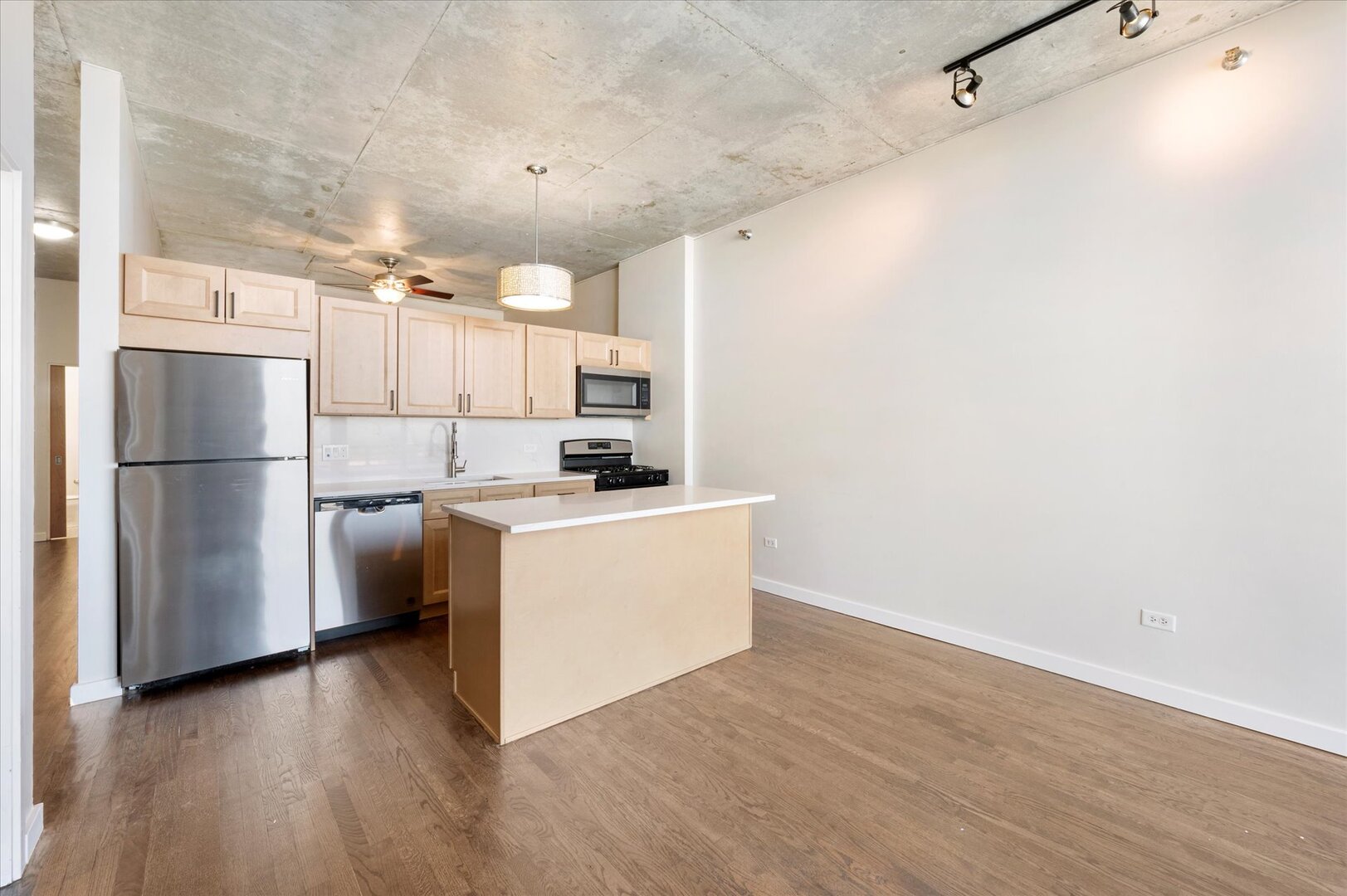 1720 South Michigan Avenue, Unit 1712 Chicago, IL 60616 - Photo 18 of 33 a kitchen with a refrigerator and a stove top oven