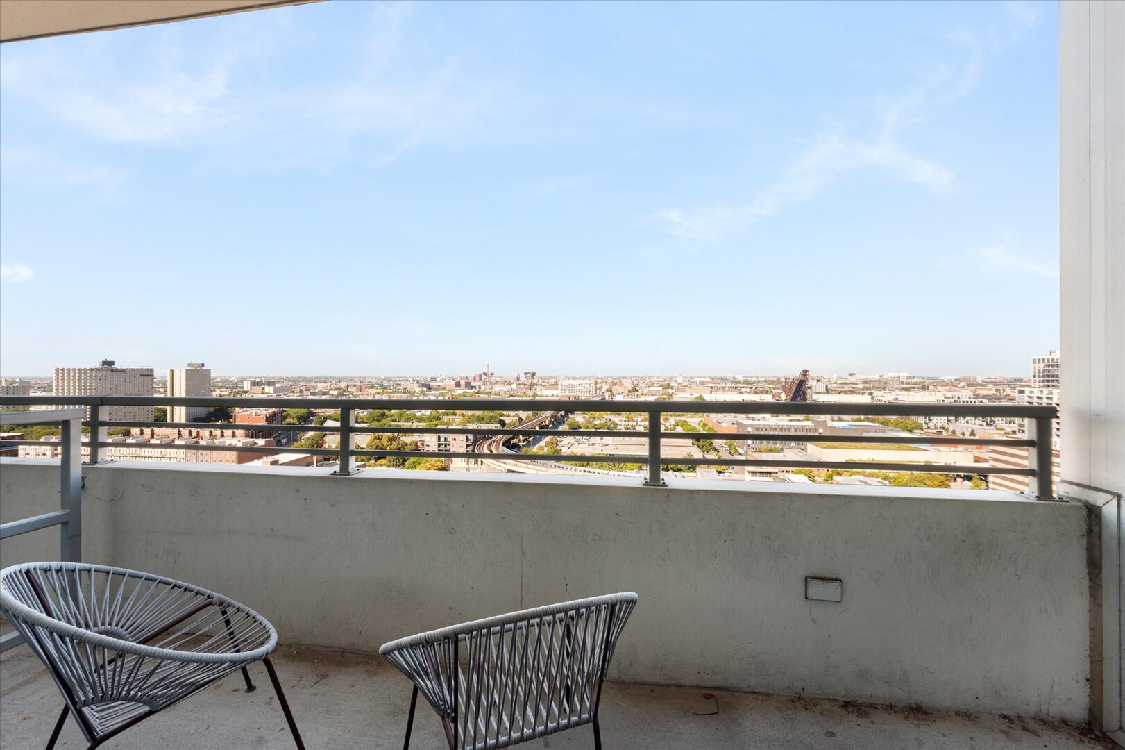 1720 South Michigan Avenue, Unit 1712 Chicago, IL 60616 - Photo 22 of 33 a view of a chairs and table in a terrace