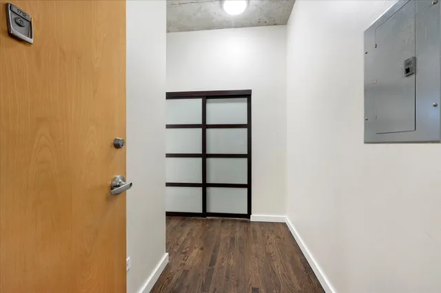 a view of a hallway with a bathroom