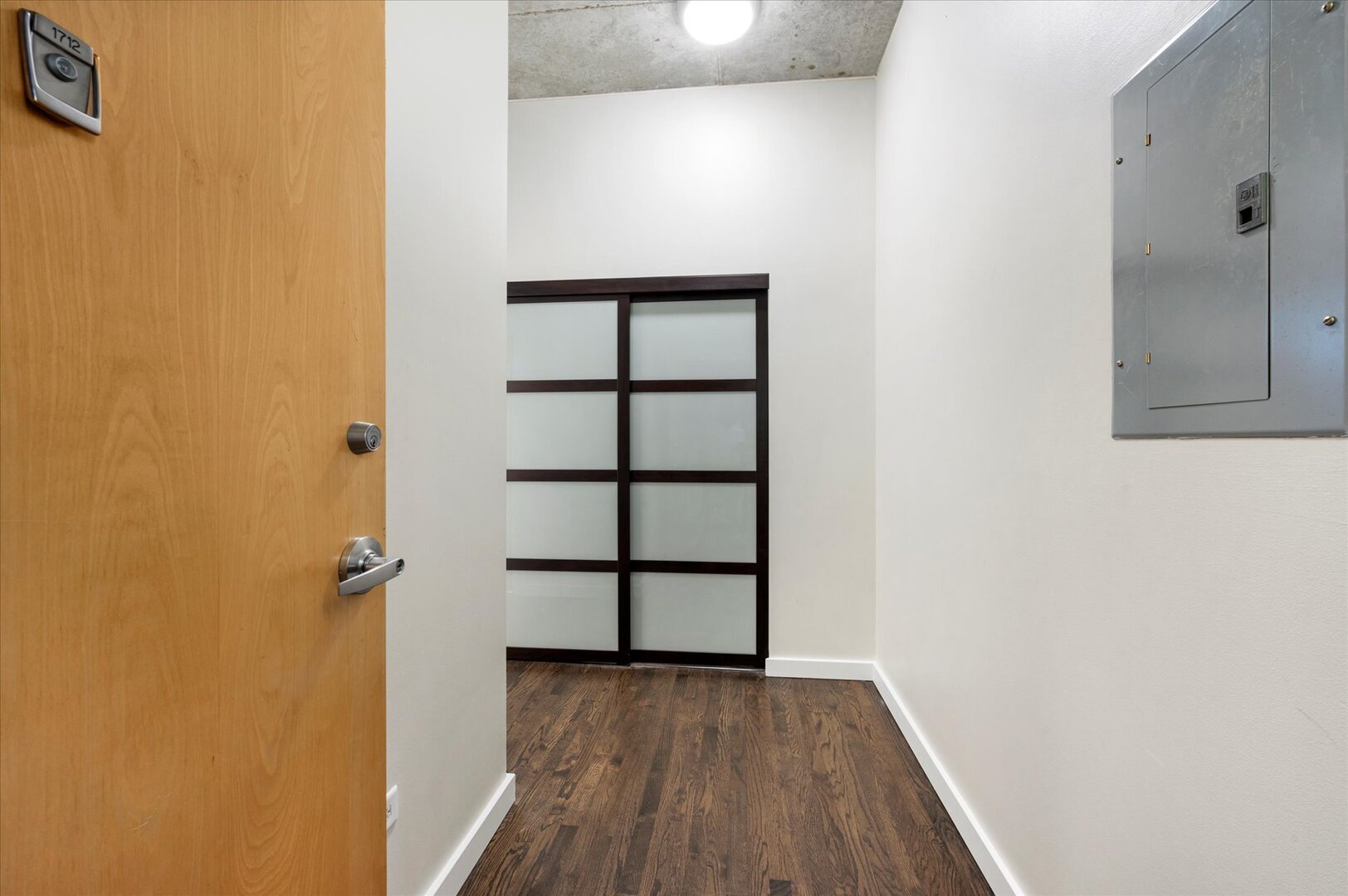 1720 South Michigan Avenue, Unit 1712 Chicago, IL 60616 - Photo 25 of 33 a view of a hallway with wooden floor and closet