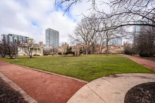 a view of a tall building next to a road