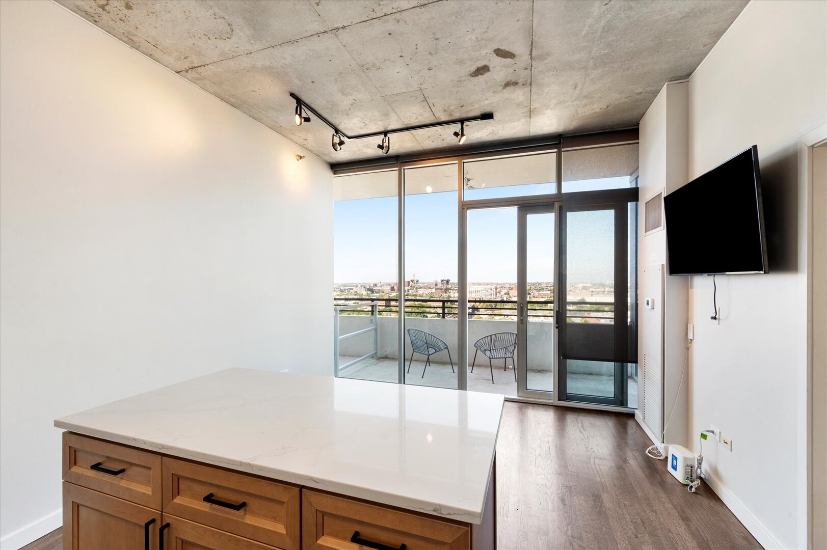 1720 South Michigan Avenue, Unit 1712 Chicago, IL 60616 - Photo 7 of 33 a view of a living room hardwood floor and a large window