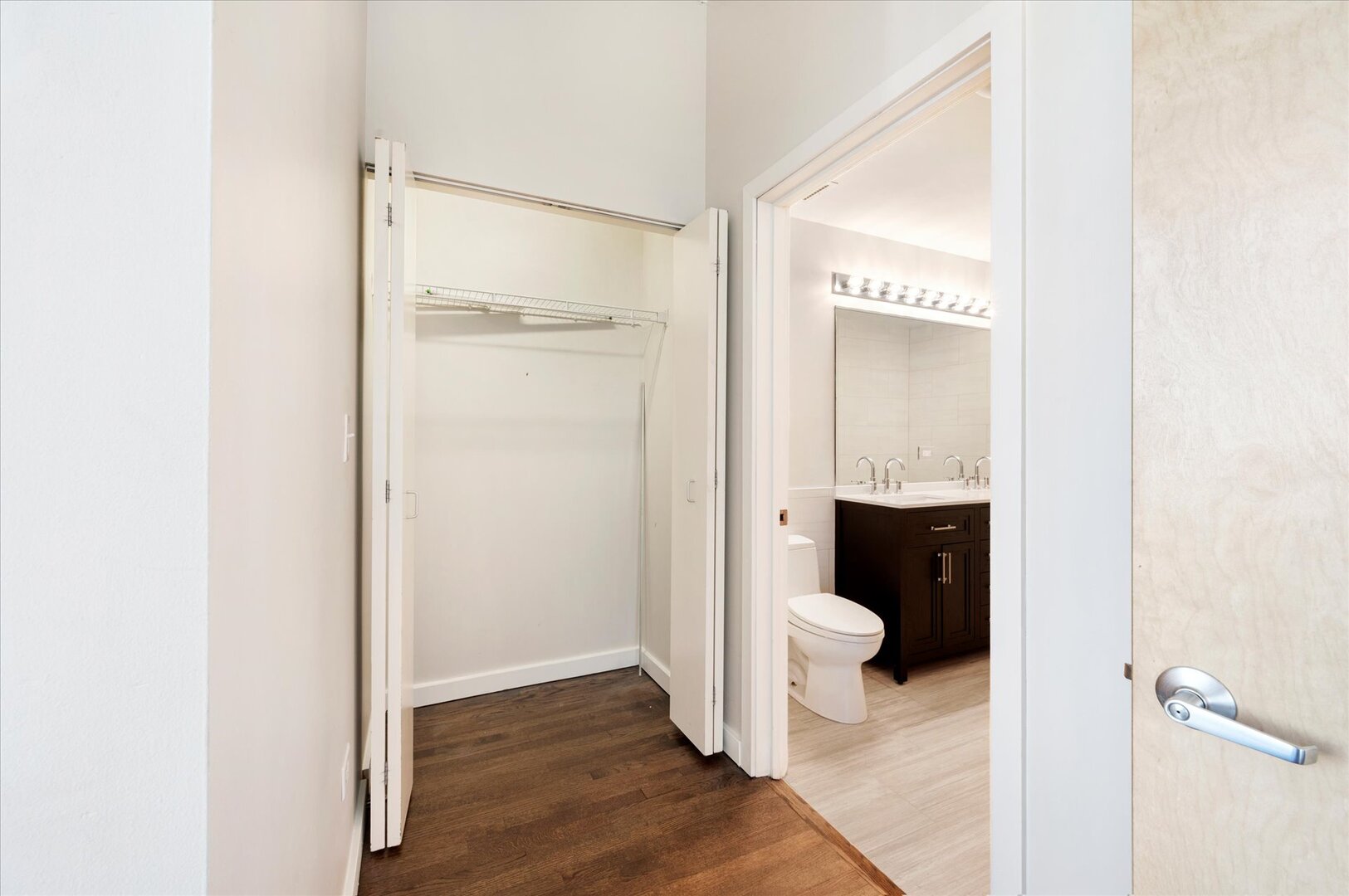 1720 South Michigan Avenue, Unit 1712 Chicago, IL 60616 - Photo 10 of 33 a bathroom with a granite countertop sink and a mirror