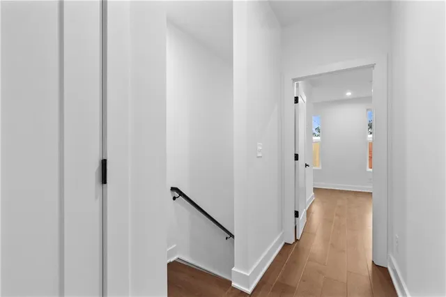 a view of a hallway with the wooden floor