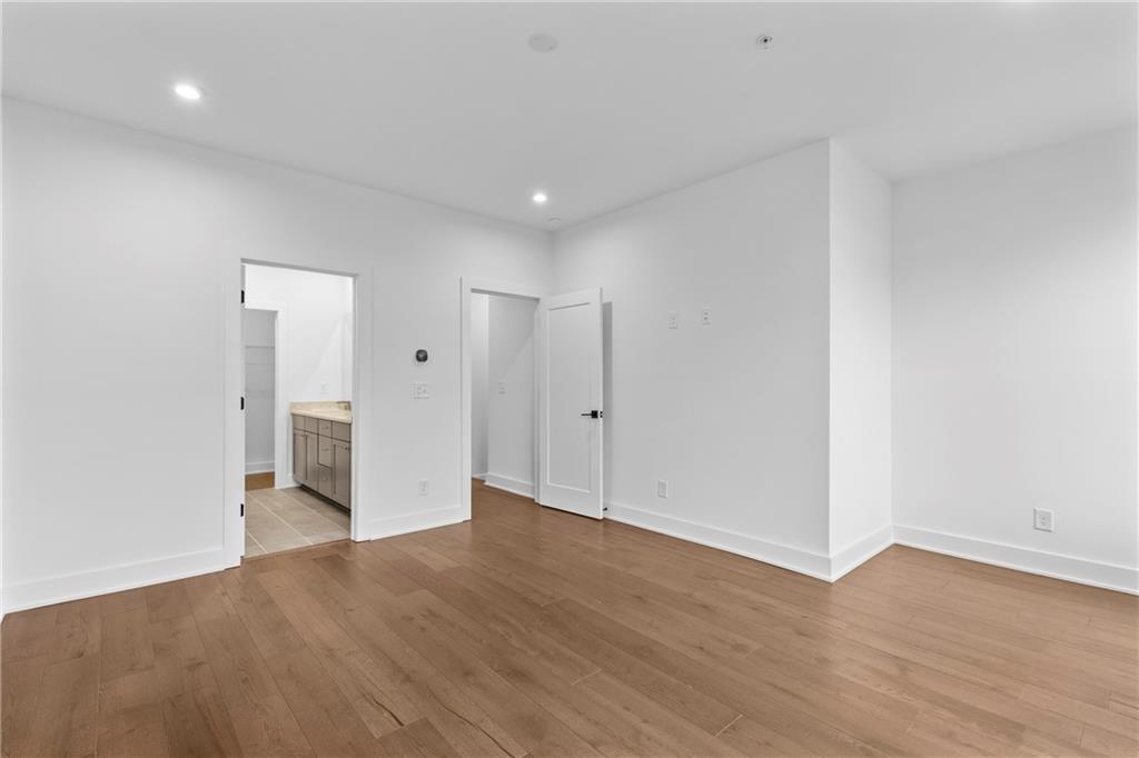 201 New Street, Unit 2304 Decatur, GA 30030 - Photo 16 of 28 a view of an empty room with wooden floor