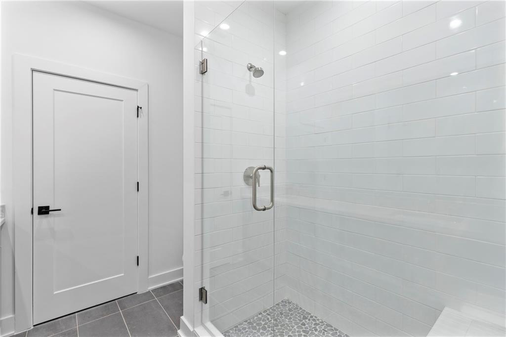 201 New Street, Unit 2304 Decatur, GA 30030 - Photo 19 of 28 a bathroom with a shower