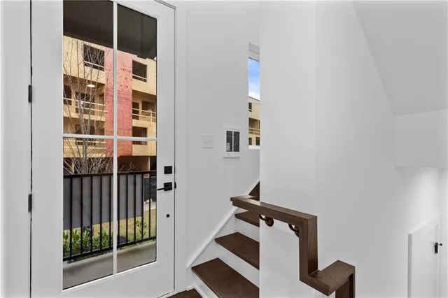 a view of walk in closet with living room