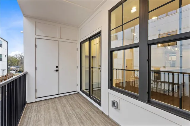 a view of an entryway with wooden floor