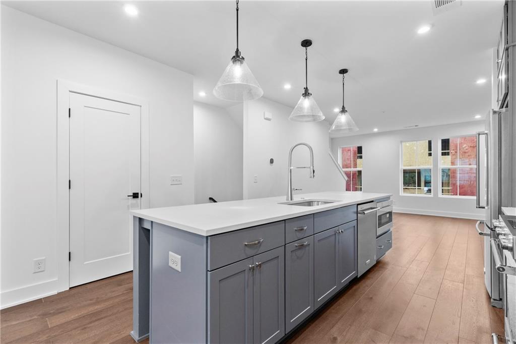 201 New Street, Unit 2304 Decatur, GA 30030 - Photo 7 of 28 a view of a double sink and a large mirror in a room