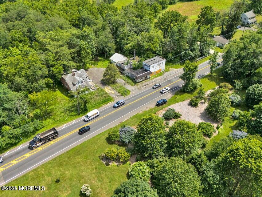 465 Lakewood Farmingdale Road Howell, NJ 07731 - Photo 4 of 19 a view of a yard with an outdoor seating