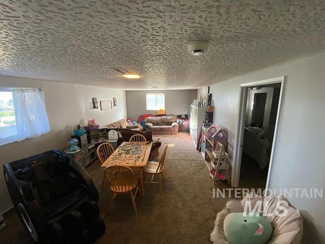 2113 Schaefer Drive Clarkston, WA 99403 - Photo 13 of 15 Carpeted dining area with a textured ceiling
