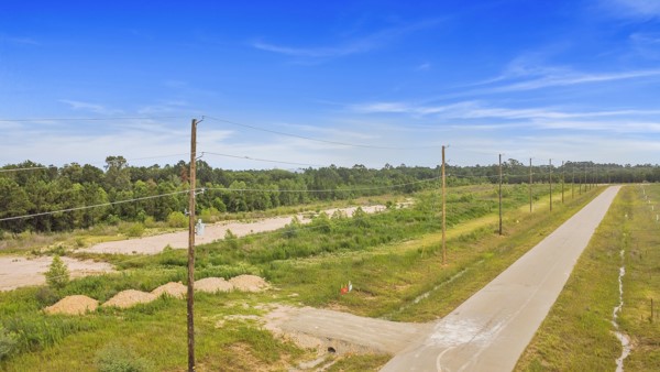 591513 121st Road Cleveland, TX 77327 - Photo 4 of 4 a view of a lake with a city