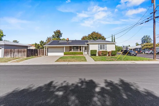 a view of multiple houses with a street