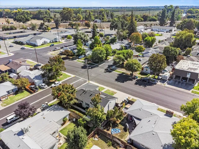 an aerial view of residential houses with outdoor space
