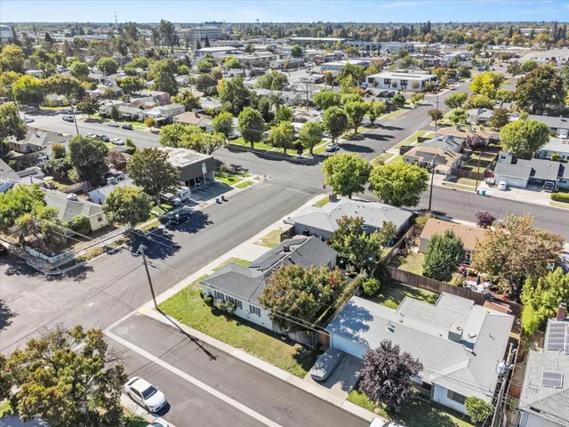 an aerial view of a residential apartment building with a garden