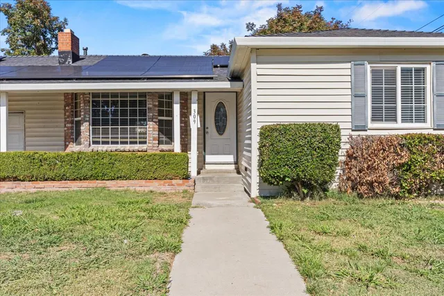 front view of a house with a yard