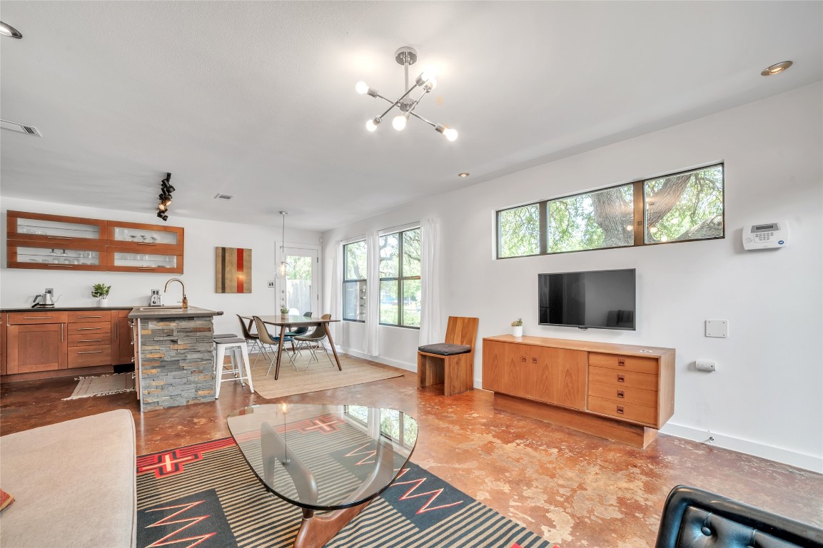 407 Philco Drive Austin, TX 78745 - Photo 1 of 1 a living room with furniture a flat screen tv and a large window