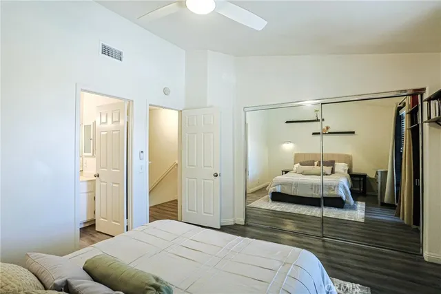 a bedroom with a bed and a walk in closet