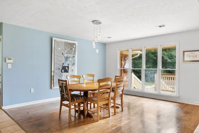 a view of a dining room with furniture window and outside view