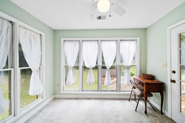 a view of room with window and furniture
