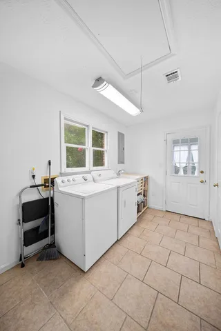a kitchen with a stove and white cabinets