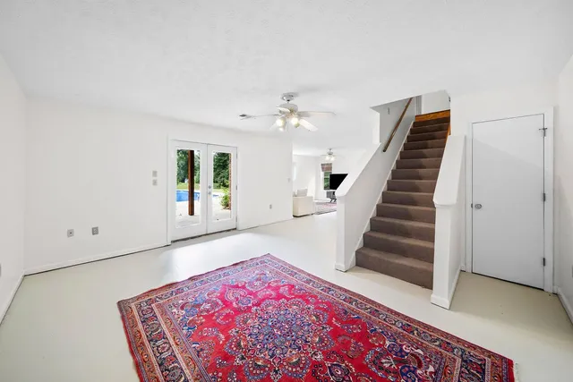 a living room with furniture and a rug