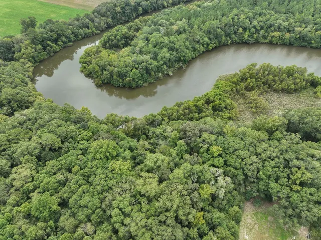 an aerial view of a houses with lake view
