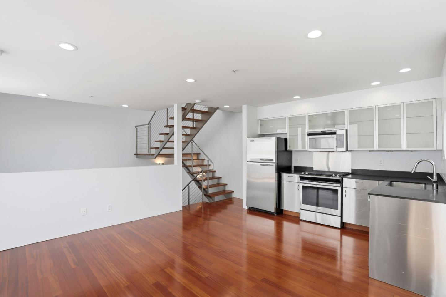 2709 Tenth Street, Unit C Berkeley, CA 94710 - Photo 17 of 44 a kitchen with stainless steel appliances a refrigerator and a stove top oven