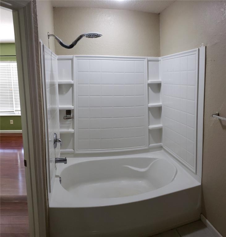 4245 Southwest 50th Circle Ocala, FL 34474 - Photo 7 of 14 a bathroom with a bathtub