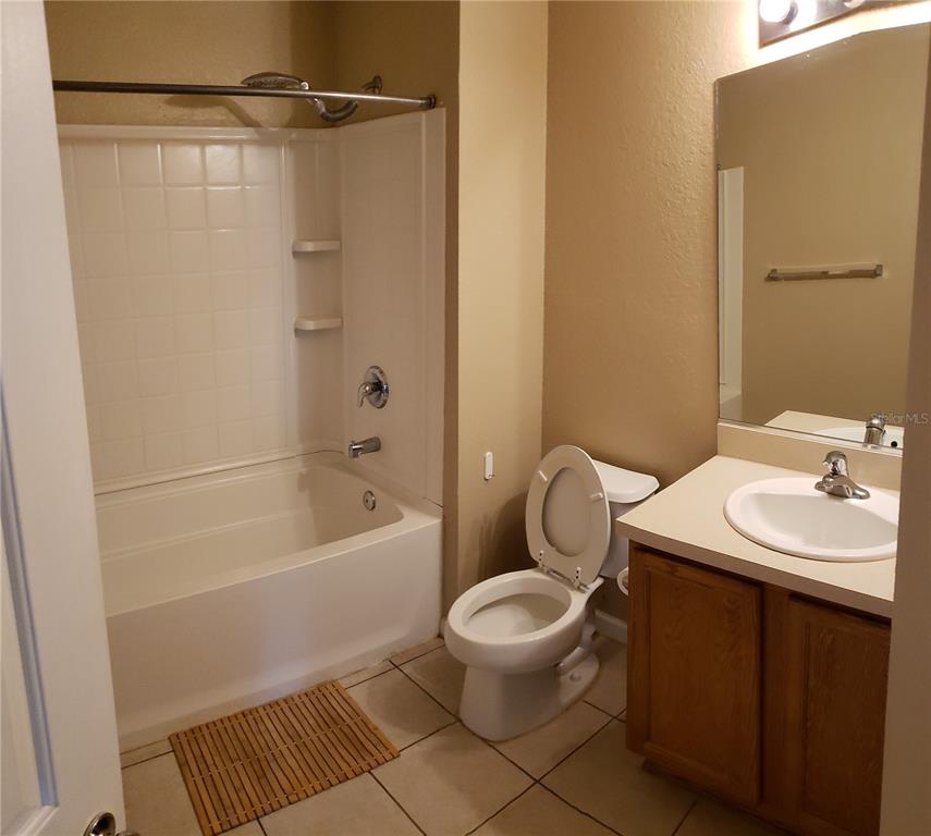 4245 Southwest 50th Circle Ocala, FL 34474 - Photo 8 of 14 a bathroom with a sink toilet and shower