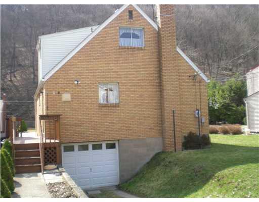 68 Spring Street Etna, PA 15223 - Photo 15 of 18 Exterior Back. Newer Garage Door with Opener