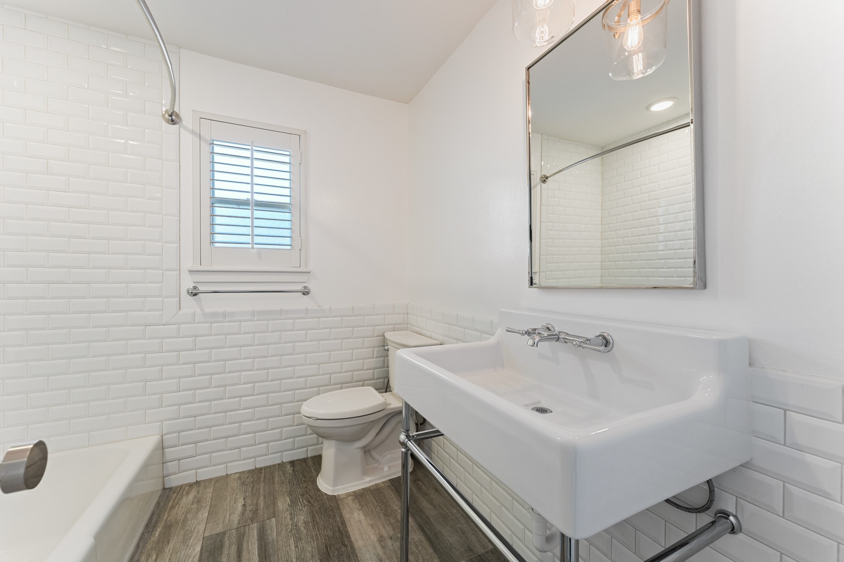 10703 Deerwood Road Houston, TX 77042 - Photo 13 of 28 Shared guest bath with vintage inspired sink and Subway tile surround.