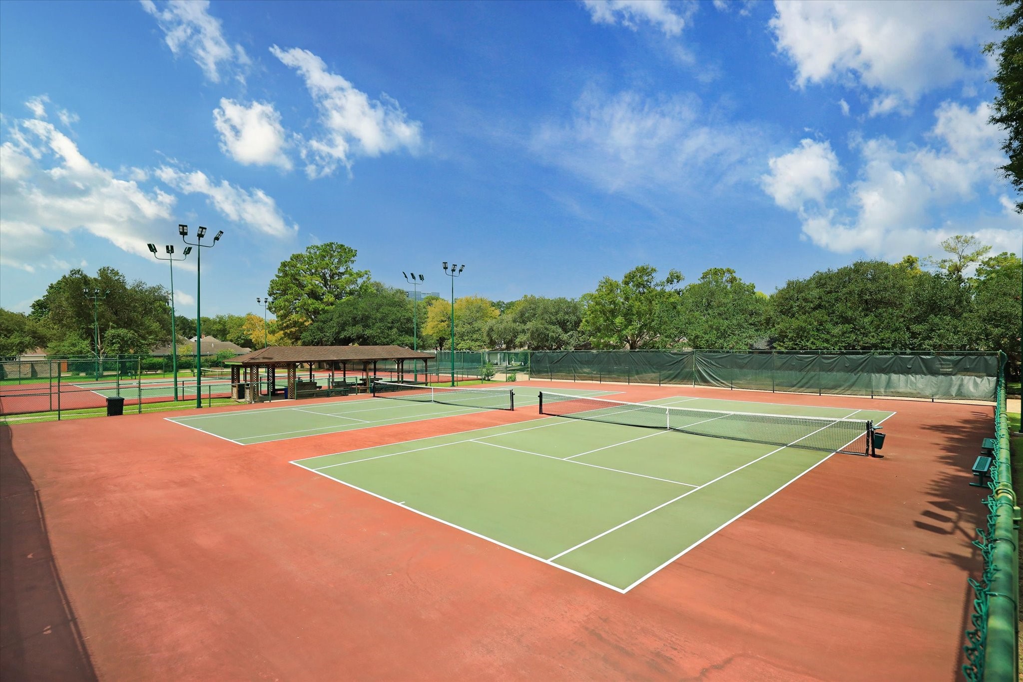10703 Deerwood Road Houston, TX 77042 - Photo 26 of 28 Three tennis courts and two Pickleball courts are available for residents to play from 6:00 am to 10:00 pm every day.
