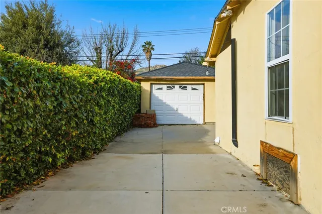 a view of a house with a yard and garage