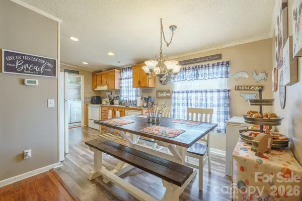 a kitchen with stainless steel appliances granite countertop a stove and a refrigerator