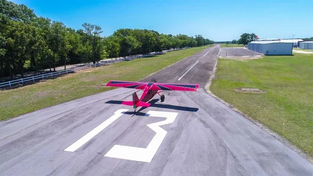 an aerial view of a house with yard swimming pool and outdoor seating