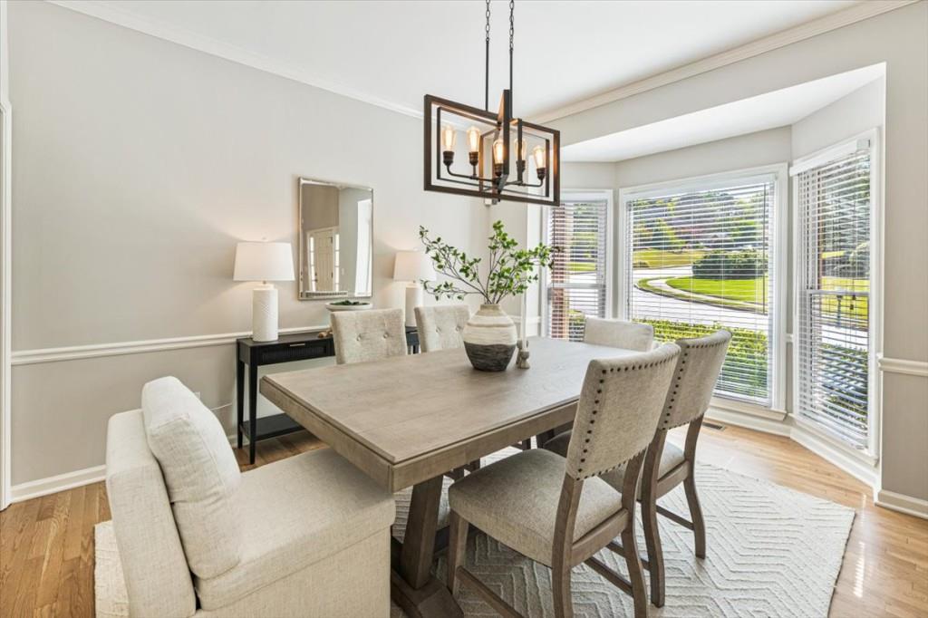 1110 Compass Pointe Crossing Alpharetta, GA 30005 - Photo 12 of 55 a view of a dining room with furniture window and outside view