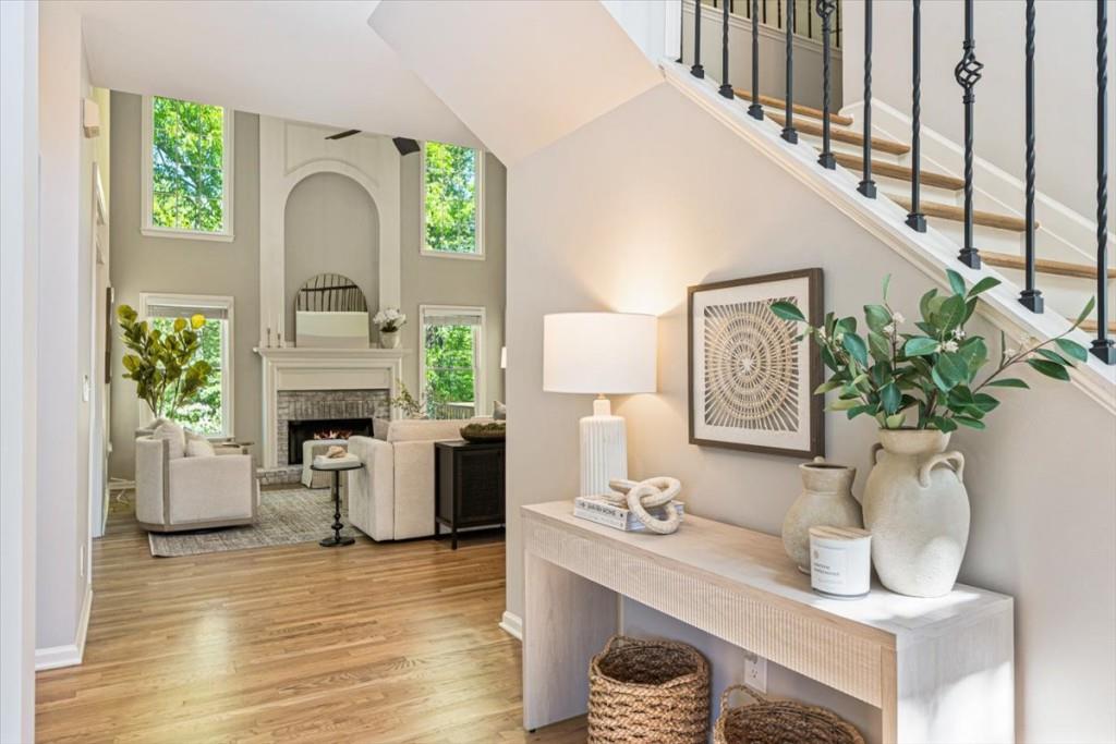 1110 Compass Pointe Crossing Alpharetta, GA 30005 - Photo 13 of 55 a living room with furniture fireplace and potted plant