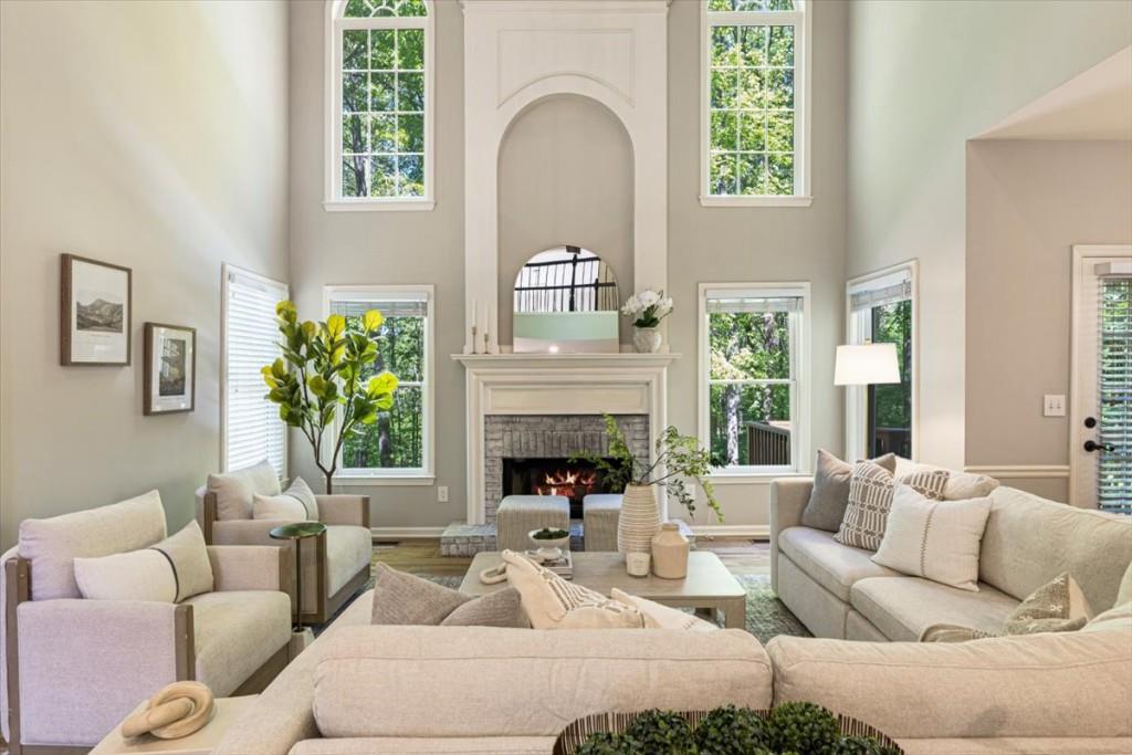 1110 Compass Pointe Crossing Alpharetta, GA 30005 - Photo 15 of 55 a living room with furniture fireplace and potted plants