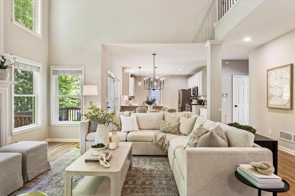 1110 Compass Pointe Crossing Alpharetta, GA 30005 - Photo 19 of 55 a living room with furniture and a large window