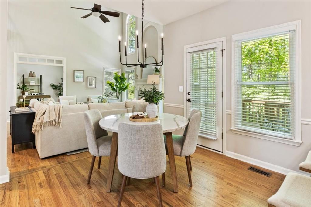1110 Compass Pointe Crossing Alpharetta, GA 30005 - Photo 20 of 55 a view of a dining room with furniture window and wooden floor